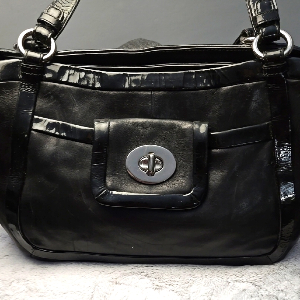 Coach Black Shoulder Bag with Leather Material and Structured Shape